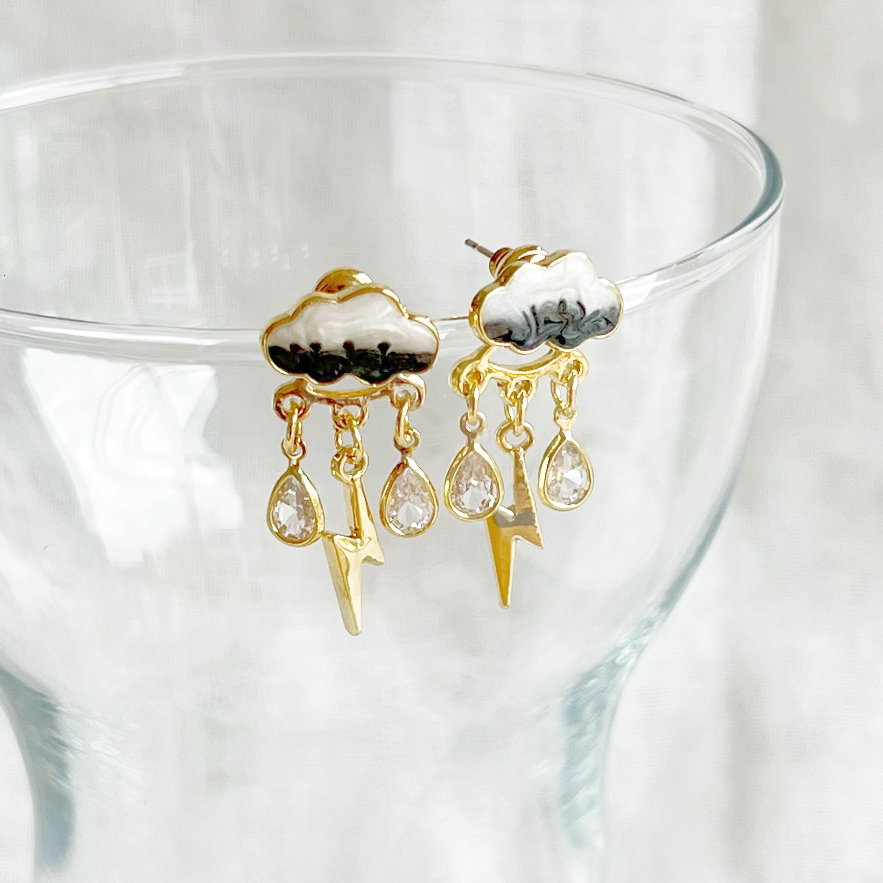 Handmade Thunderstorm Rain Cloud Earrings featuring sterling silver studs and gold plated bronze base, symbolizing positivity.