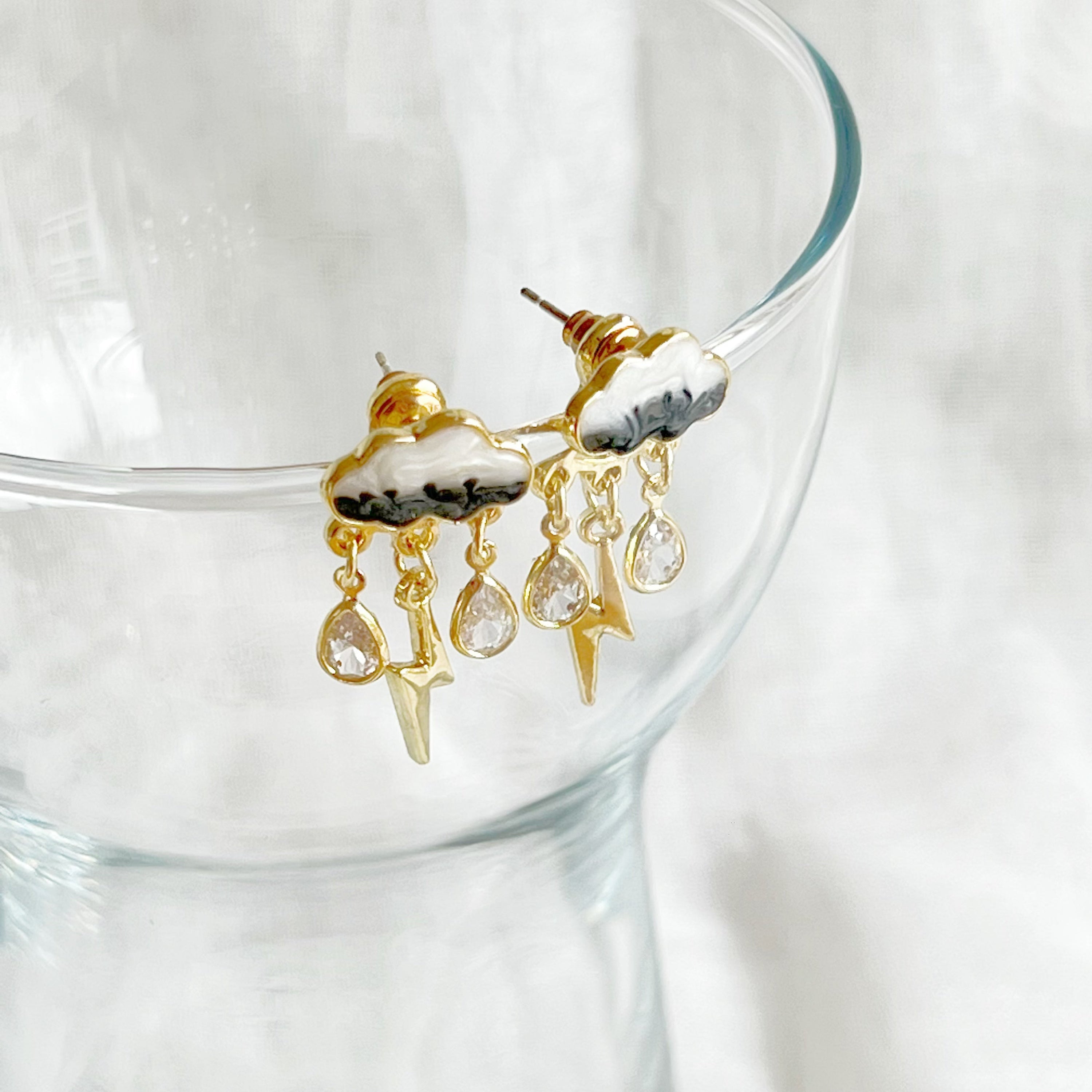 Handmade Thunderstorm Rain Cloud Earrings featuring sterling silver studs and gold plated bronze base, symbolizing positivity.