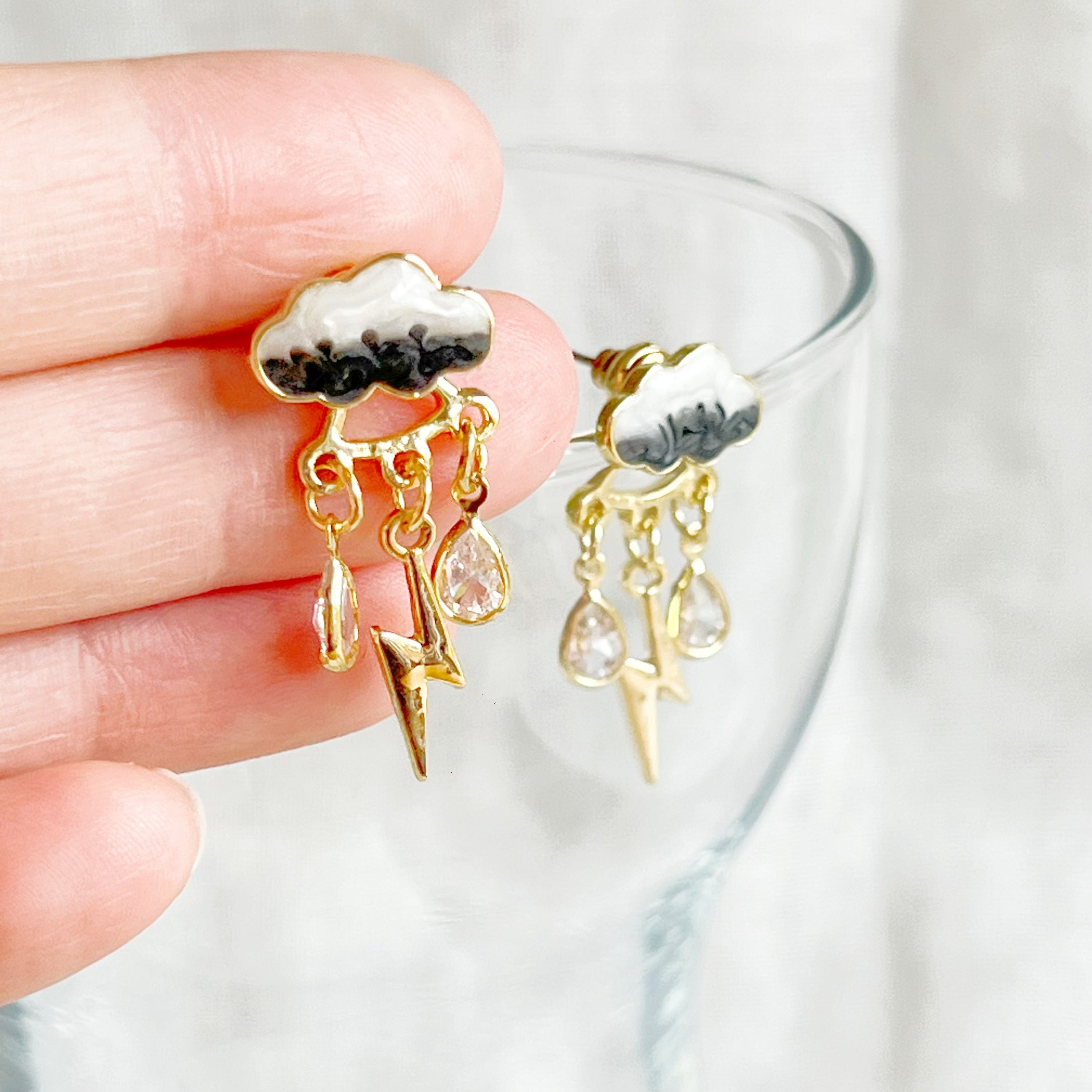 Handmade Thunderstorm Rain Cloud Earrings featuring sterling silver studs and gold plated bronze base, symbolizing positivity.