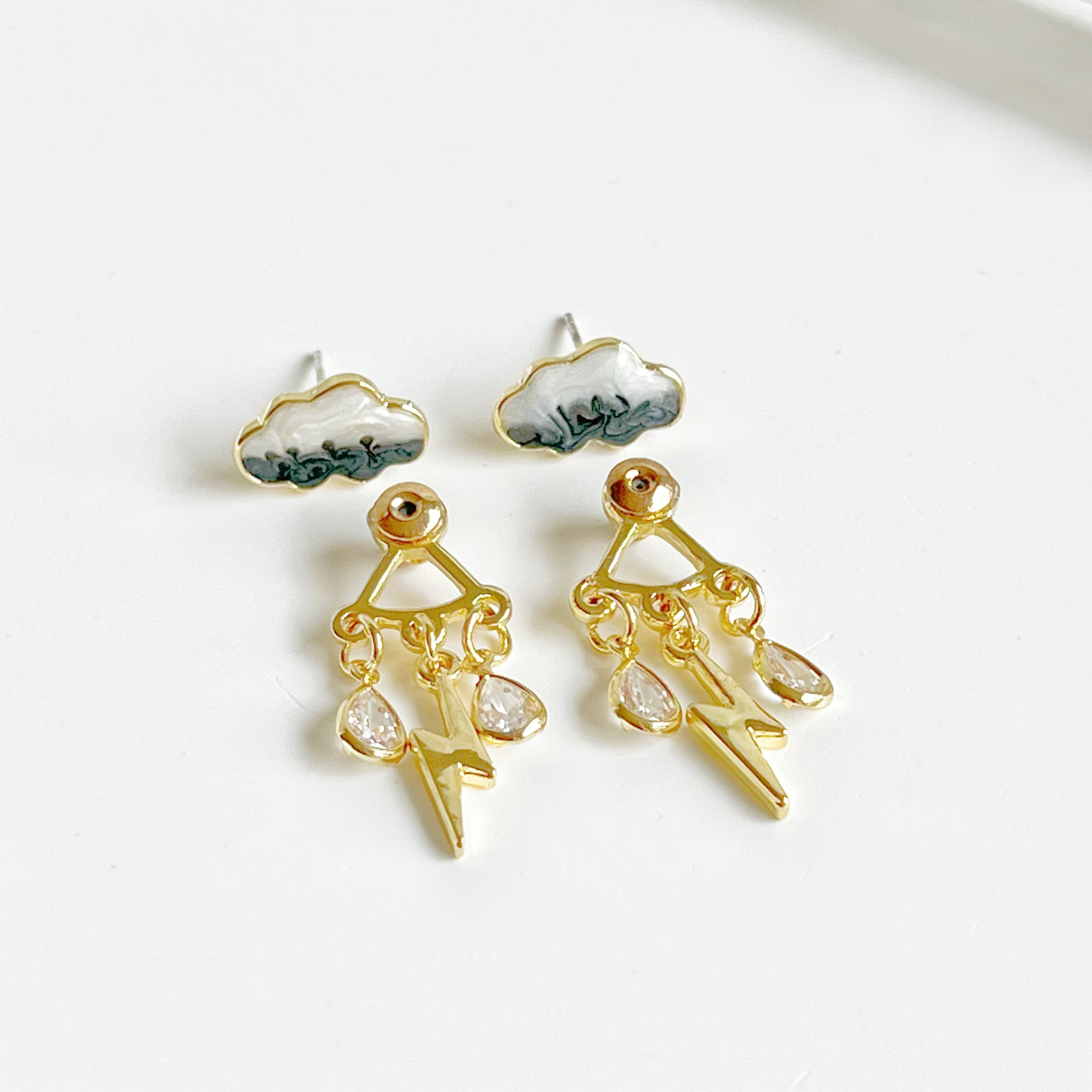 Handmade Thunderstorm Rain Cloud Earrings featuring sterling silver studs and gold plated bronze base, symbolizing positivity.