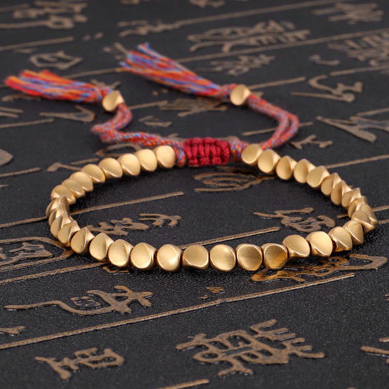 Tibetan Copper Beads Braided Cotton Good Luck Friendship Bracelet, featuring handmade copper beads and adjustable cotton rope.