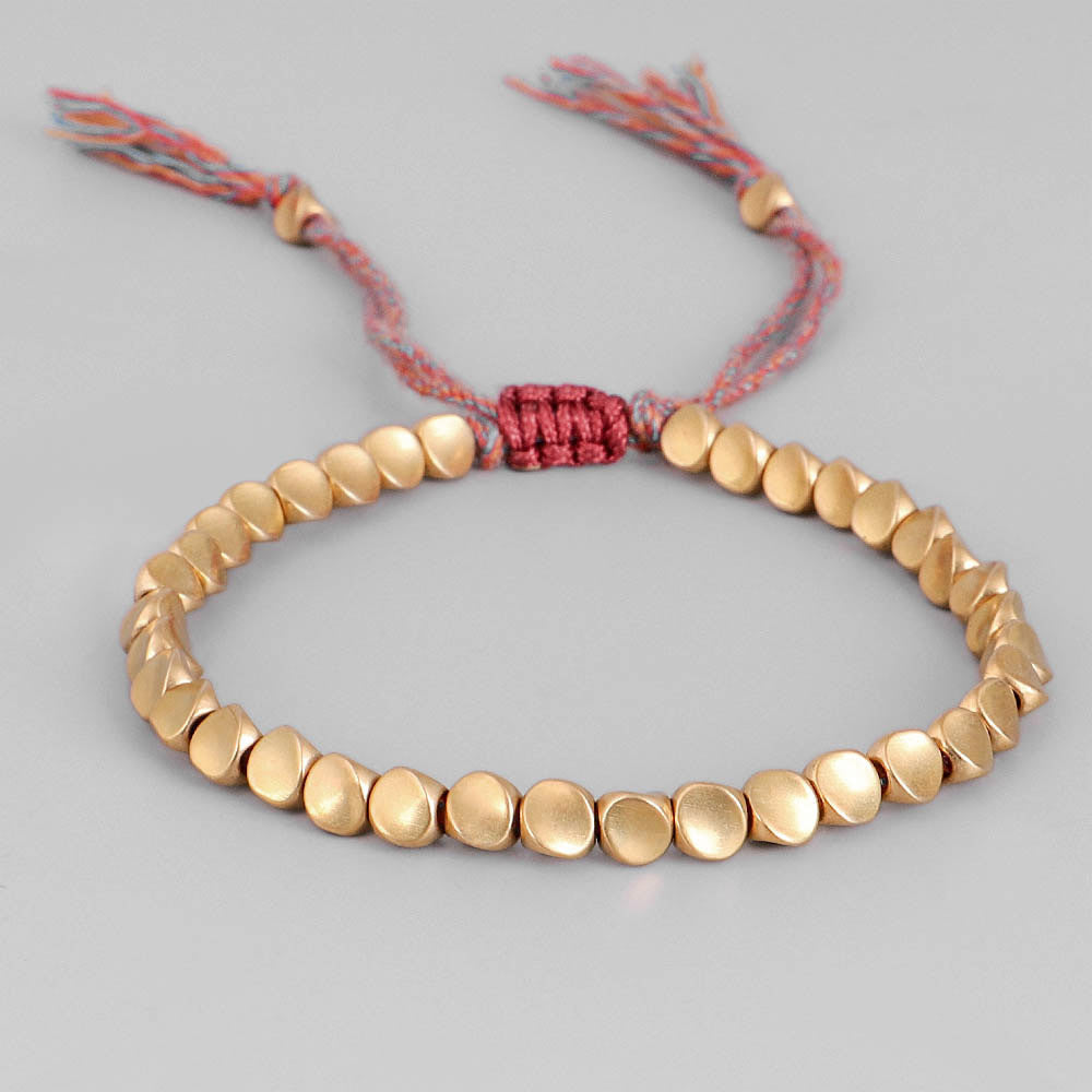 Tibetan Copper Beads Braided Cotton Good Luck Friendship Bracelet, featuring handmade copper beads and adjustable cotton rope.