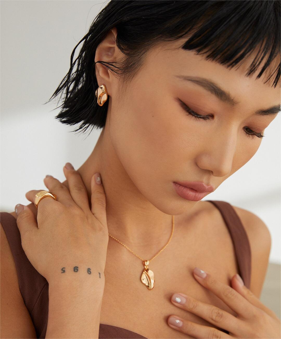 A stunning Timeless Polished Style Open Ring made of sterling silver with a gold vermeil finish, showcasing its elegant design.