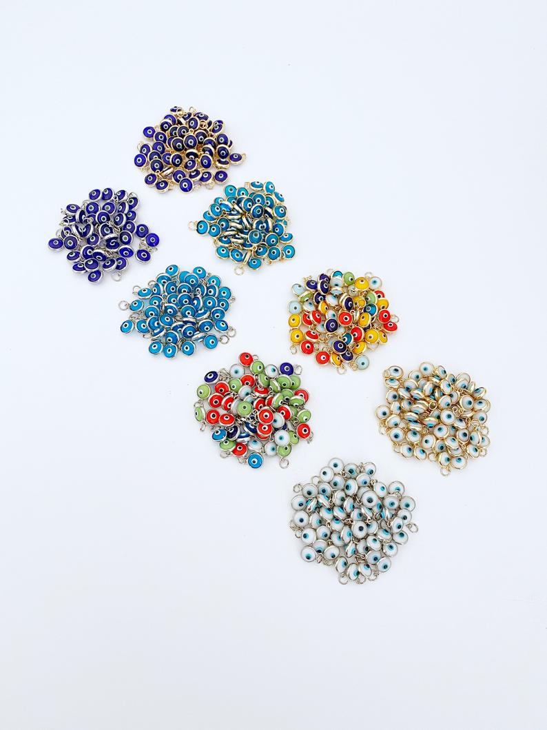 Tiny Evil Eye Charm set featuring 6mm beads in gold and silver finishes, ideal for DIY jewelry making.