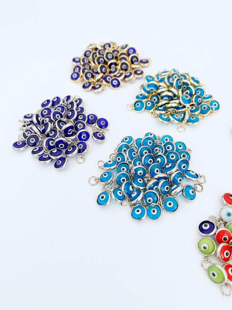 Tiny Evil Eye Charm set featuring 6mm beads in gold and silver finishes, ideal for DIY jewelry making.