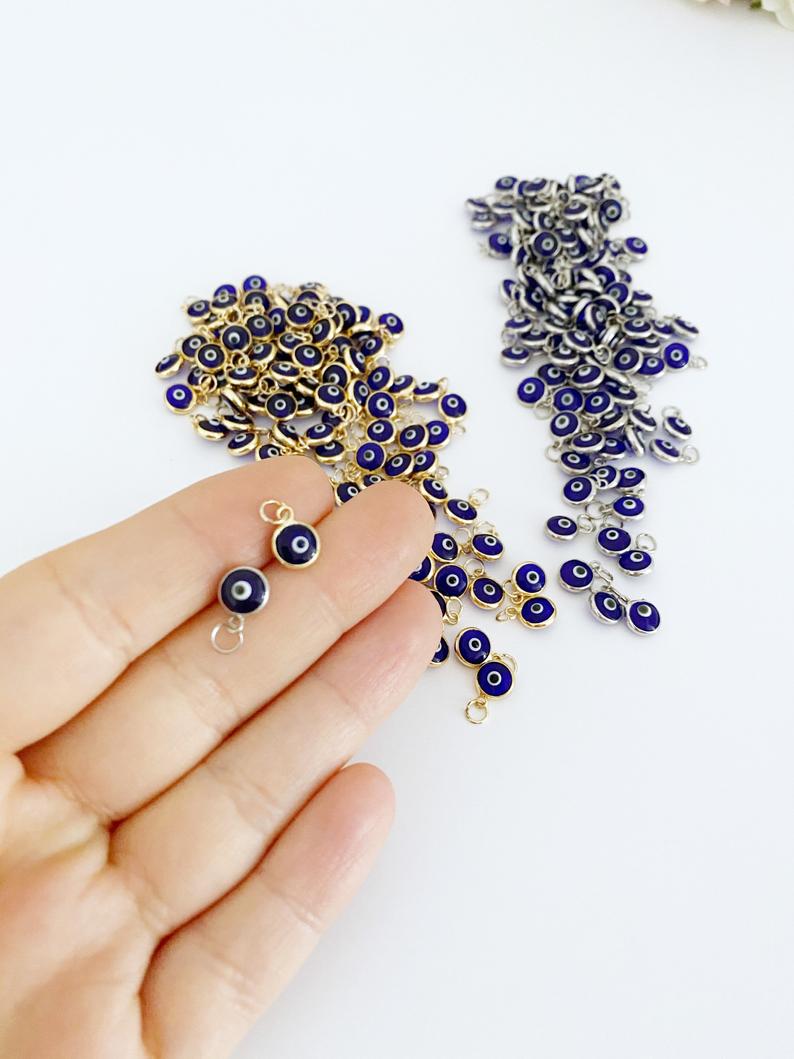 Tiny Evil Eye Charm set featuring 6mm beads in gold and silver finishes, ideal for DIY jewelry making.