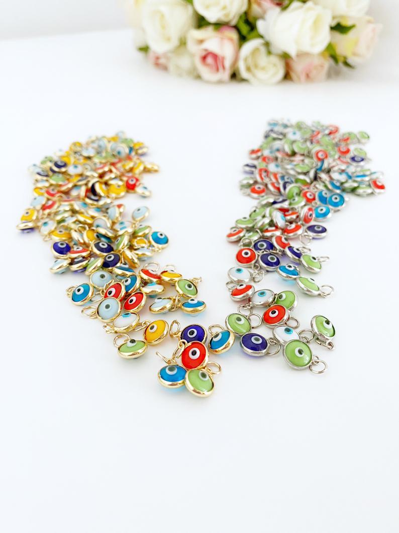 Tiny Evil Eye Charm set featuring 6mm beads in gold and silver finishes, ideal for DIY jewelry making.