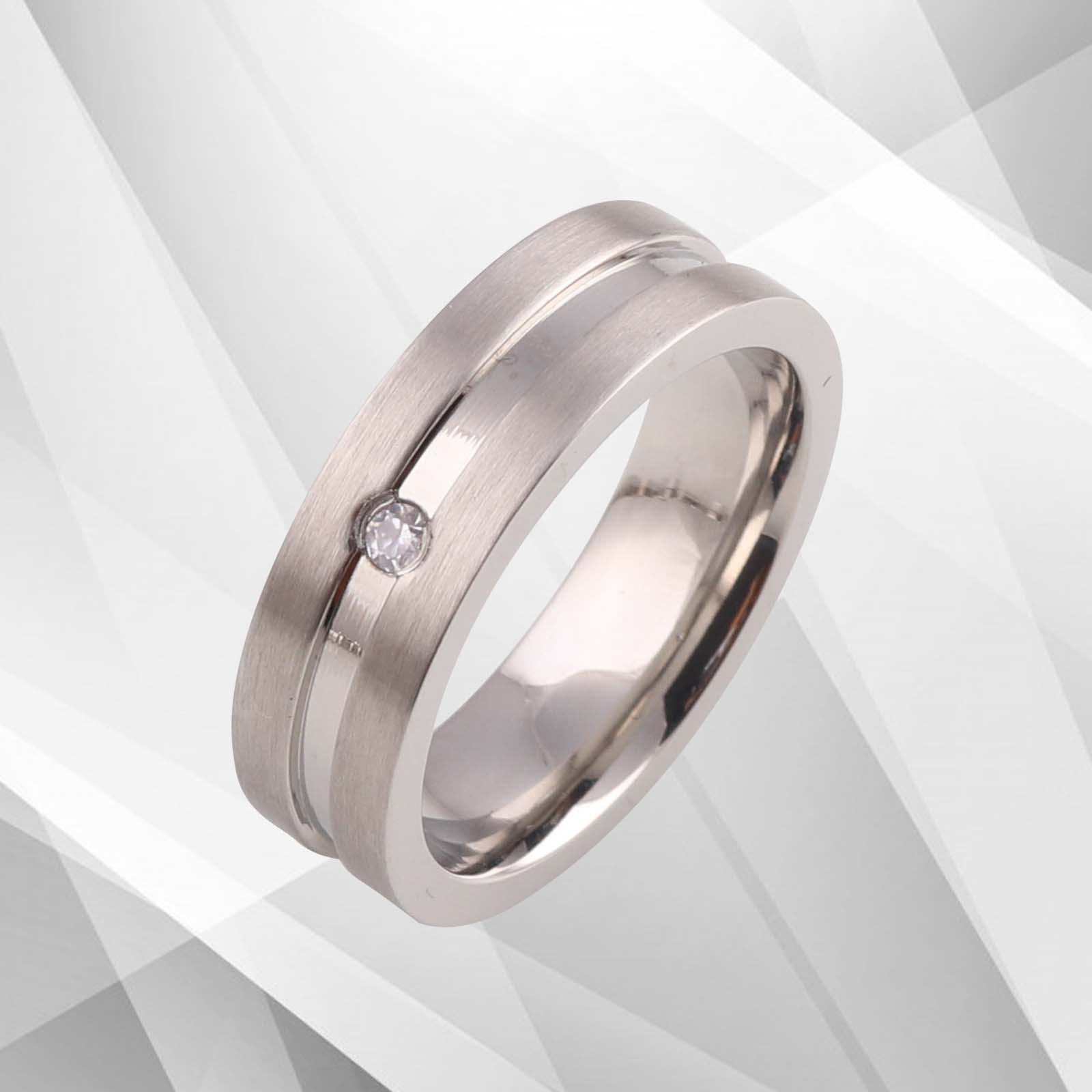 A stunning titanium wedding ring featuring a 0.35Ct CZ diamond, elegantly plated with 18Ct white gold, showcasing a brushed and sparkling finish.