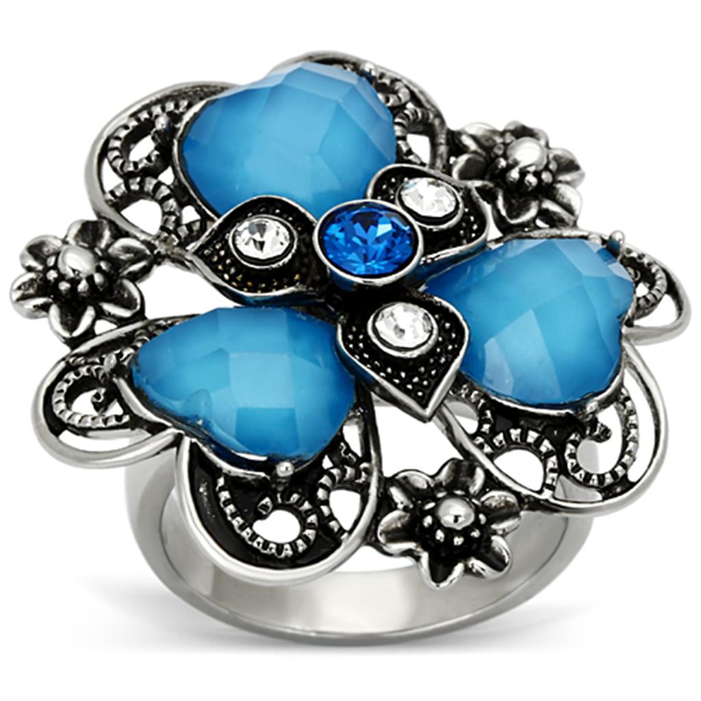 High polished stainless steel ring featuring a sea blue synthetic stone, showcasing a sleek and elegant design.