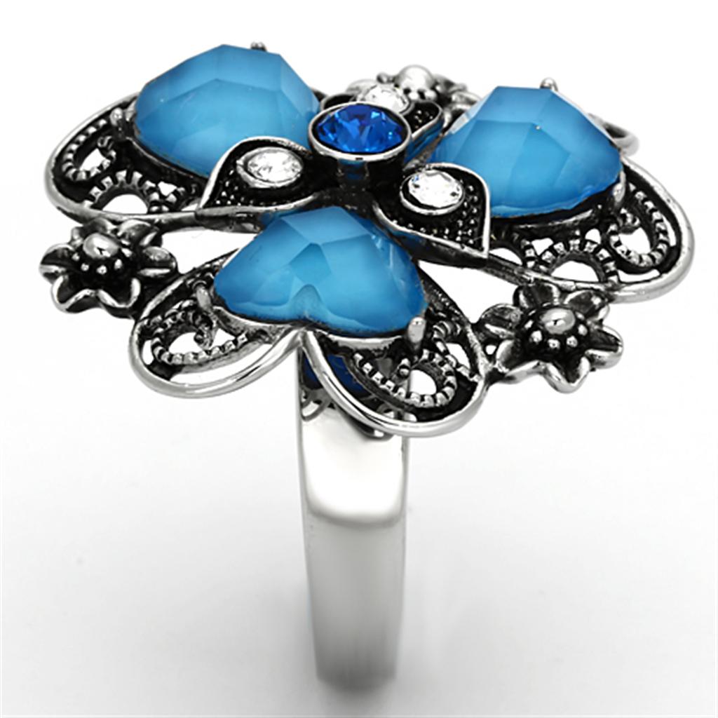 High polished stainless steel ring featuring a sea blue synthetic stone, showcasing a sleek and elegant design.