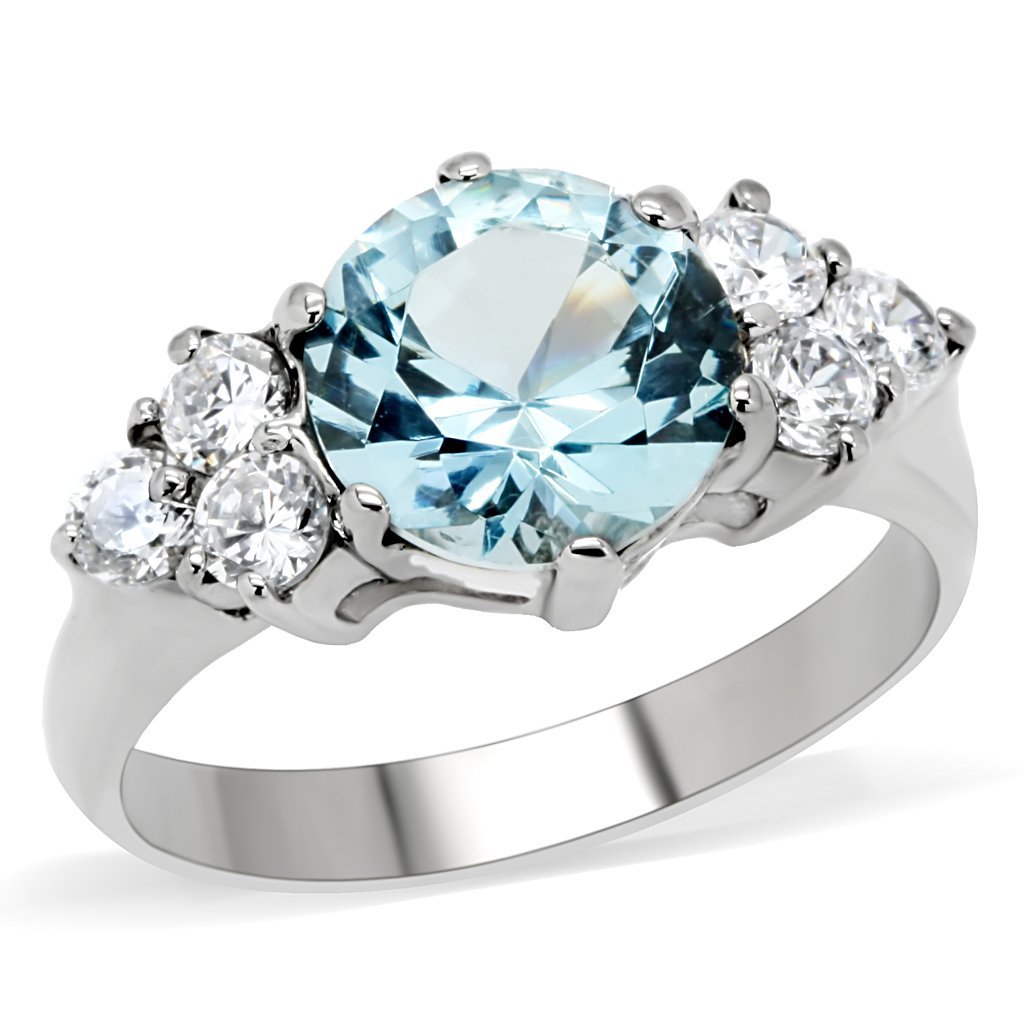Silver ring with blue gemstone.