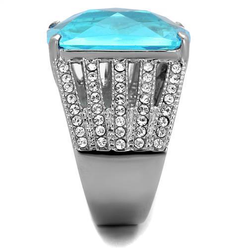 High polished stainless steel ring featuring a sea blue synthetic glass stone, showcasing a sleek and modern design.