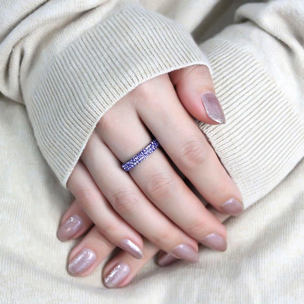 TK3540 High Polished Stainless Steel Ring featuring a tanzanite crystal centerpiece, showcasing its elegant design and high shine.