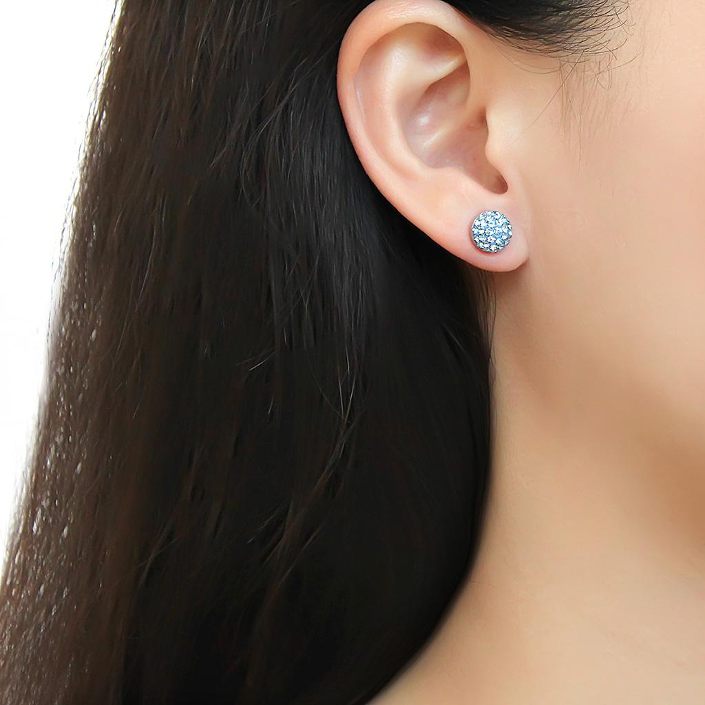 High polished stainless steel earrings featuring a sea blue top grade crystal, showcasing elegance and modern design.
