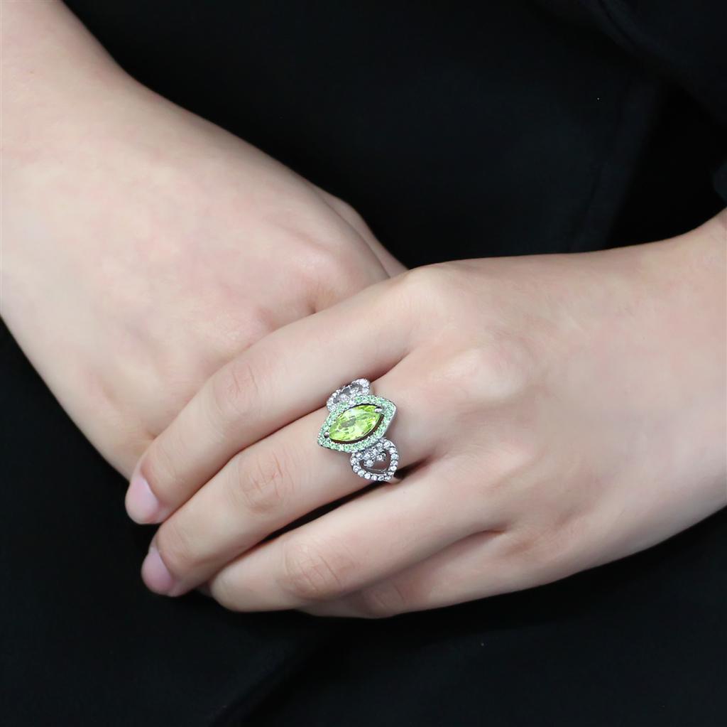 TK3579 No Plating Stainless Steel Ring featuring an AAA Grade CZ in vibrant apple green color, showcasing its elegant design.