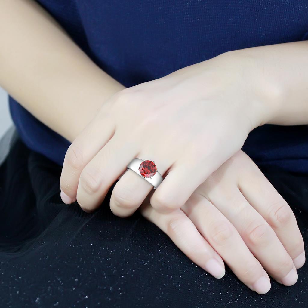 High polished stainless steel ring featuring an AAA grade garnet CZ stone, showcasing a brilliant shine and elegant design.