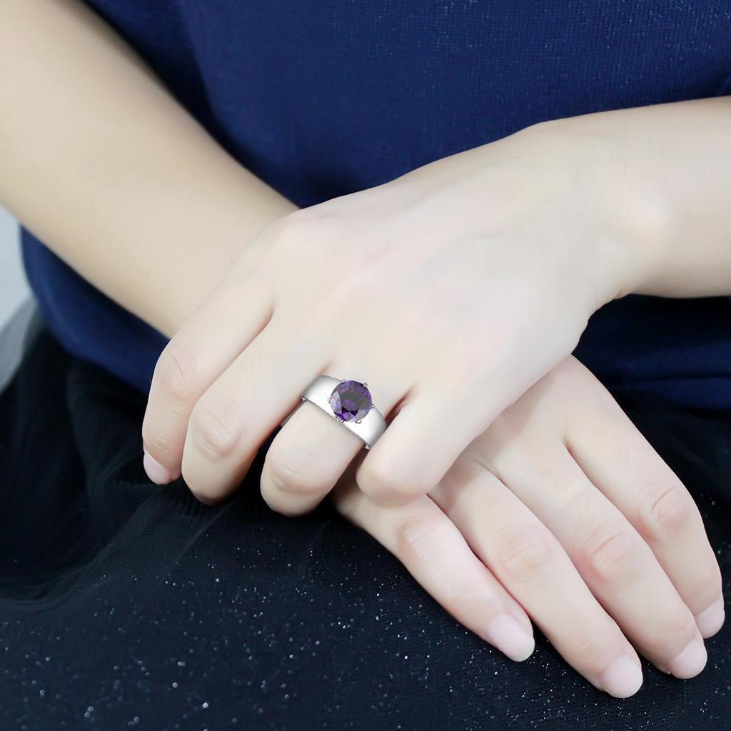 High polished stainless steel ring featuring a AAA grade Amethyst cubic zirconia stone, showcasing a sleek and elegant design.