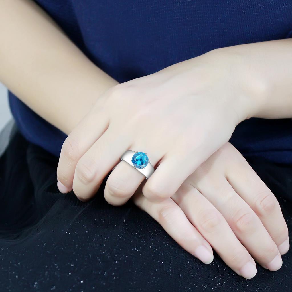 TK52003 High Polished Stainless Steel Ring featuring a sea blue synthetic glass stone, showcasing a sleek and modern design.