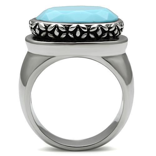 TK525 High Polished Stainless Steel Ring featuring a synthetic sea blue glass center stone, showcasing its elegant design and shine.