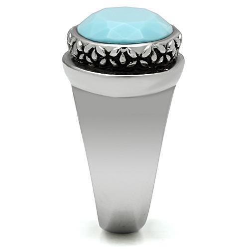 TK525 High Polished Stainless Steel Ring featuring a synthetic sea blue glass center stone, showcasing its elegant design and shine.