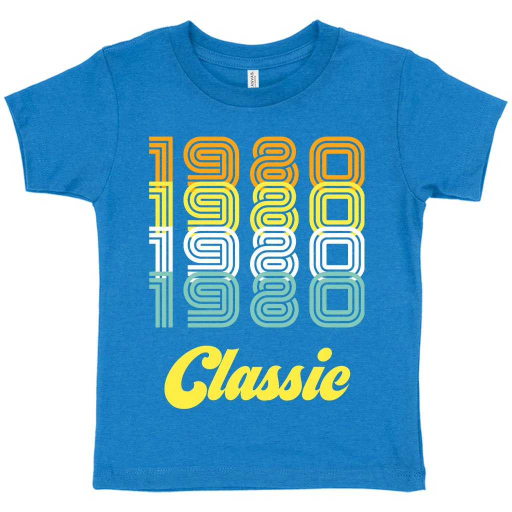 Toddler wearing a soft and stylish 1980 Classic T-Shirt, showcasing vibrant colors and retro design.
