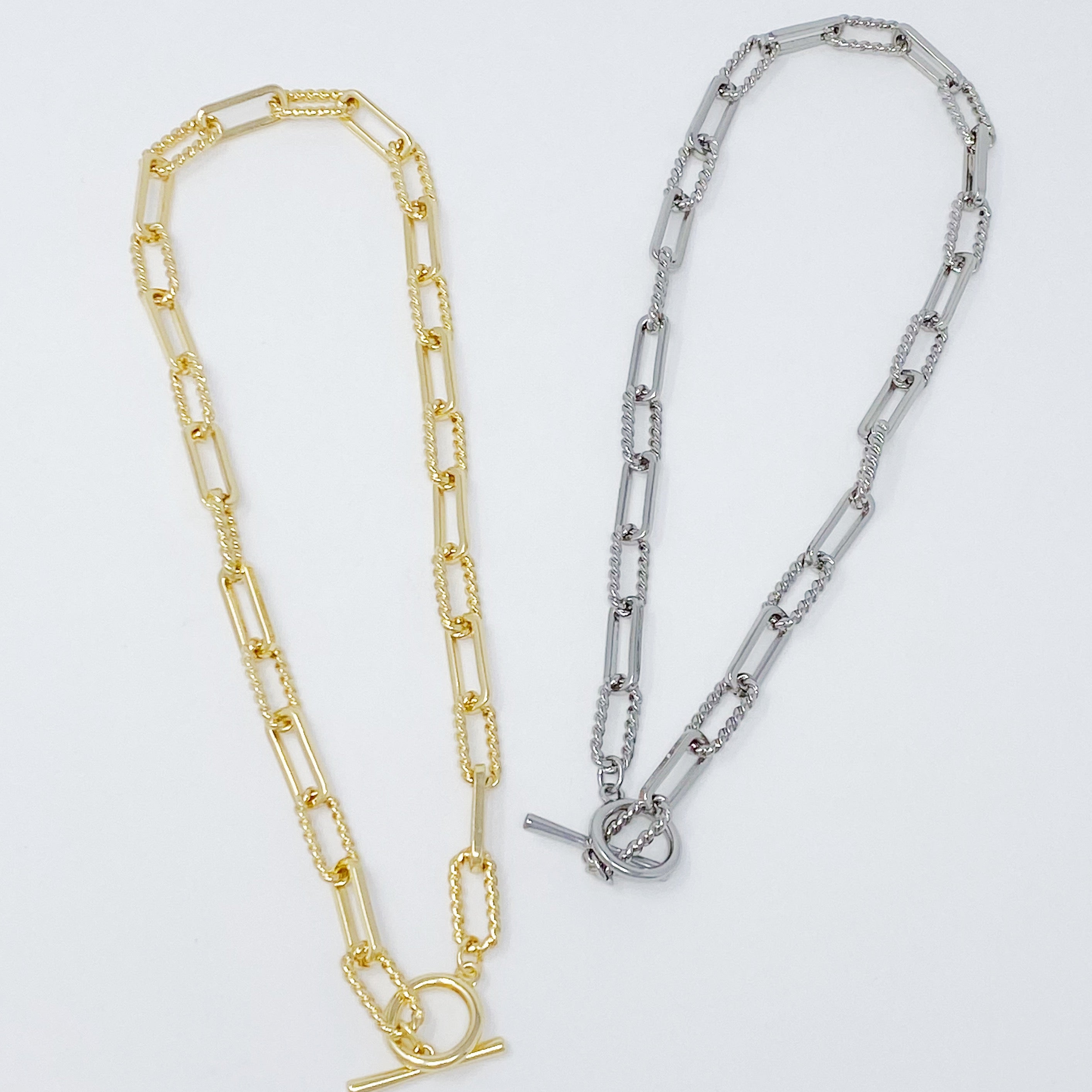A stylish gold plated Toggle Chain Link Necklace featuring a toggle clasp and a 16-inch chain with a 2-inch extender.