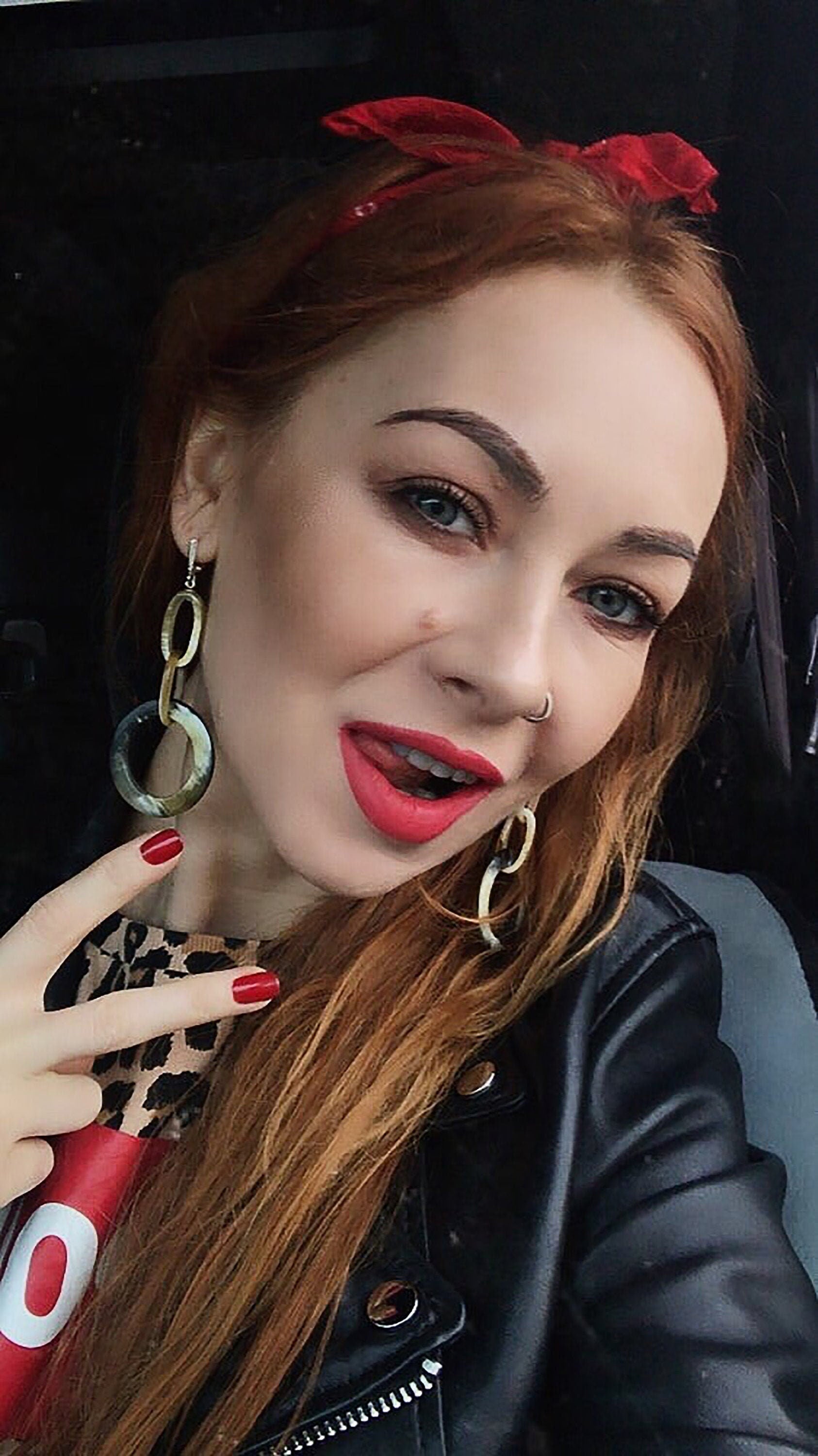 A pair of beautiful tortoise shell earrings featuring a round horn design, perfect for everyday wear.