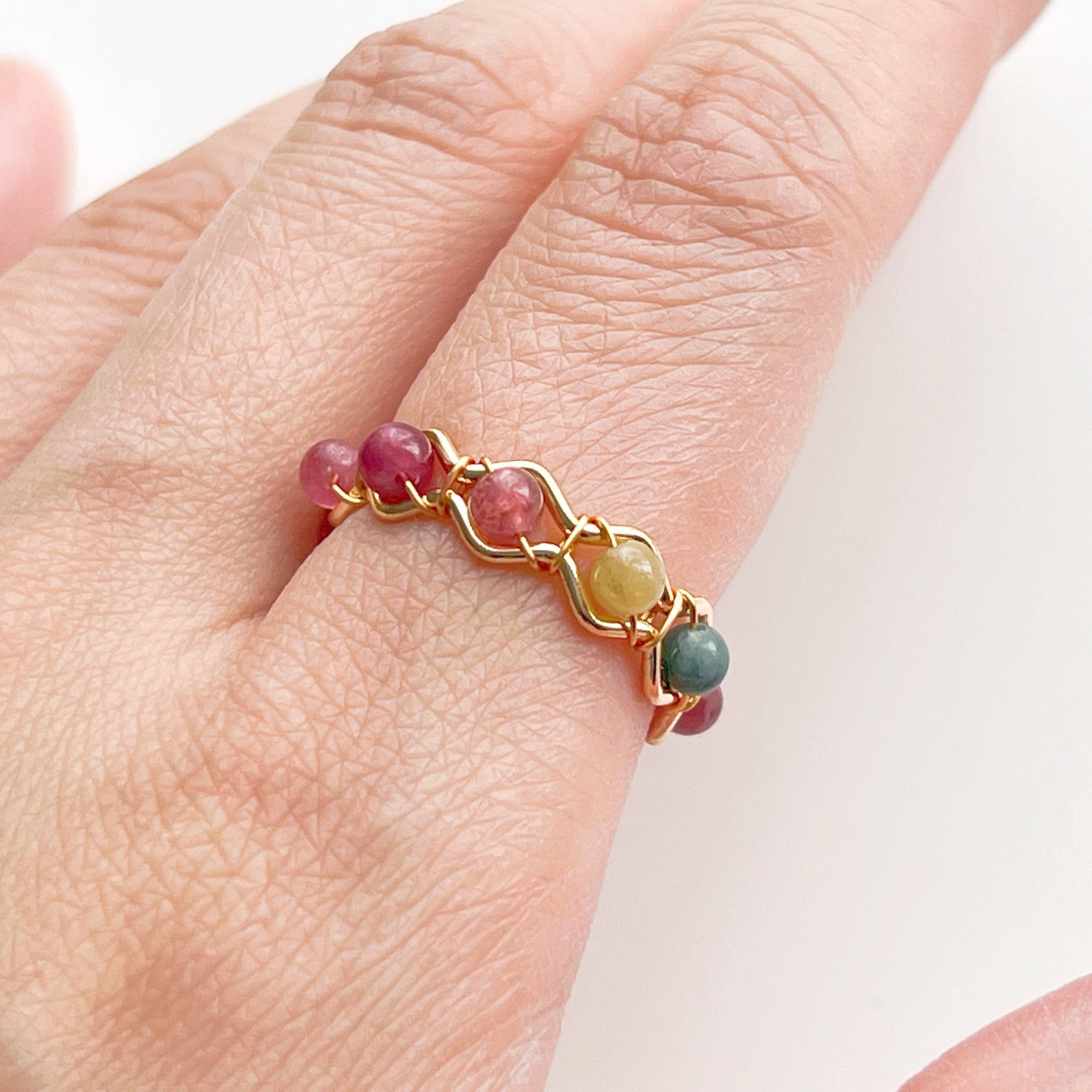Adjustable Tourmaline Beaded Ring featuring vibrant rainbow gemstones on gold plated bronze wire, elegantly displayed in a gift box.