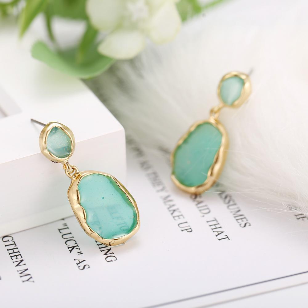 Elegant Transparent Glass Stone Drop Earring in green with 18K gold plating, showcasing a luxurious design perfect for any occasion.