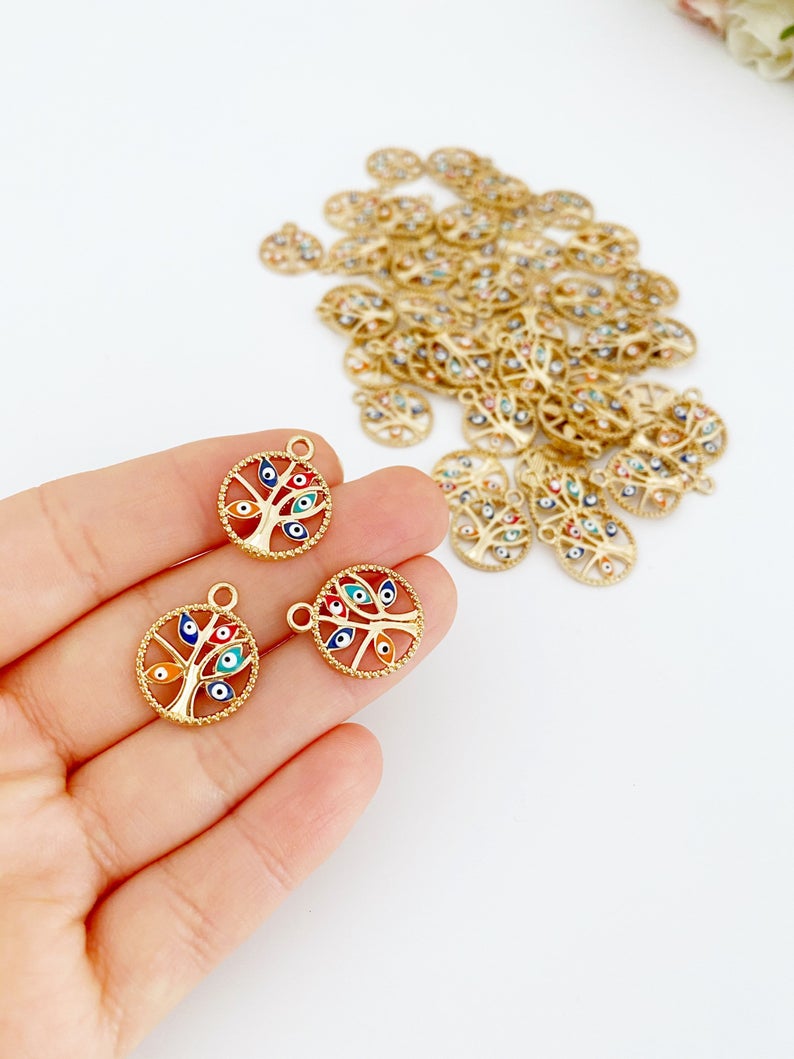 Gold Tree of Life Charm with Evil Eye design, perfect for jewelry making, featuring an enamel finish and measuring 18-20mm in diameter.