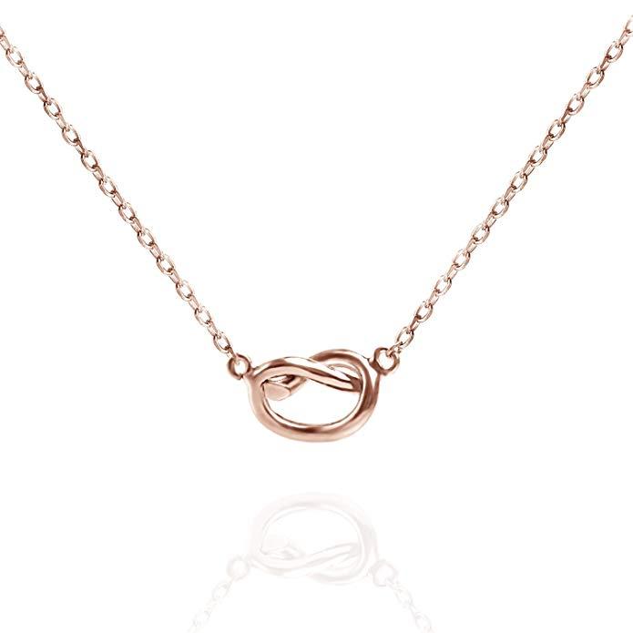 Trendy Twist Necklace in 14K rose gold plating, featuring a unique twist design and an adjustable length of 18 inches plus a 2-inch extender.