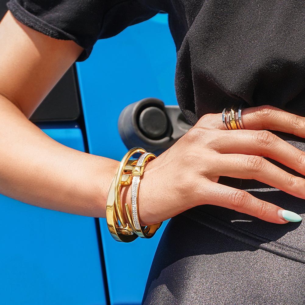 Tricolor Intertwined Statement Ring made of surgical stainless steel with 14K gold plating, showcasing a unique intertwined design.