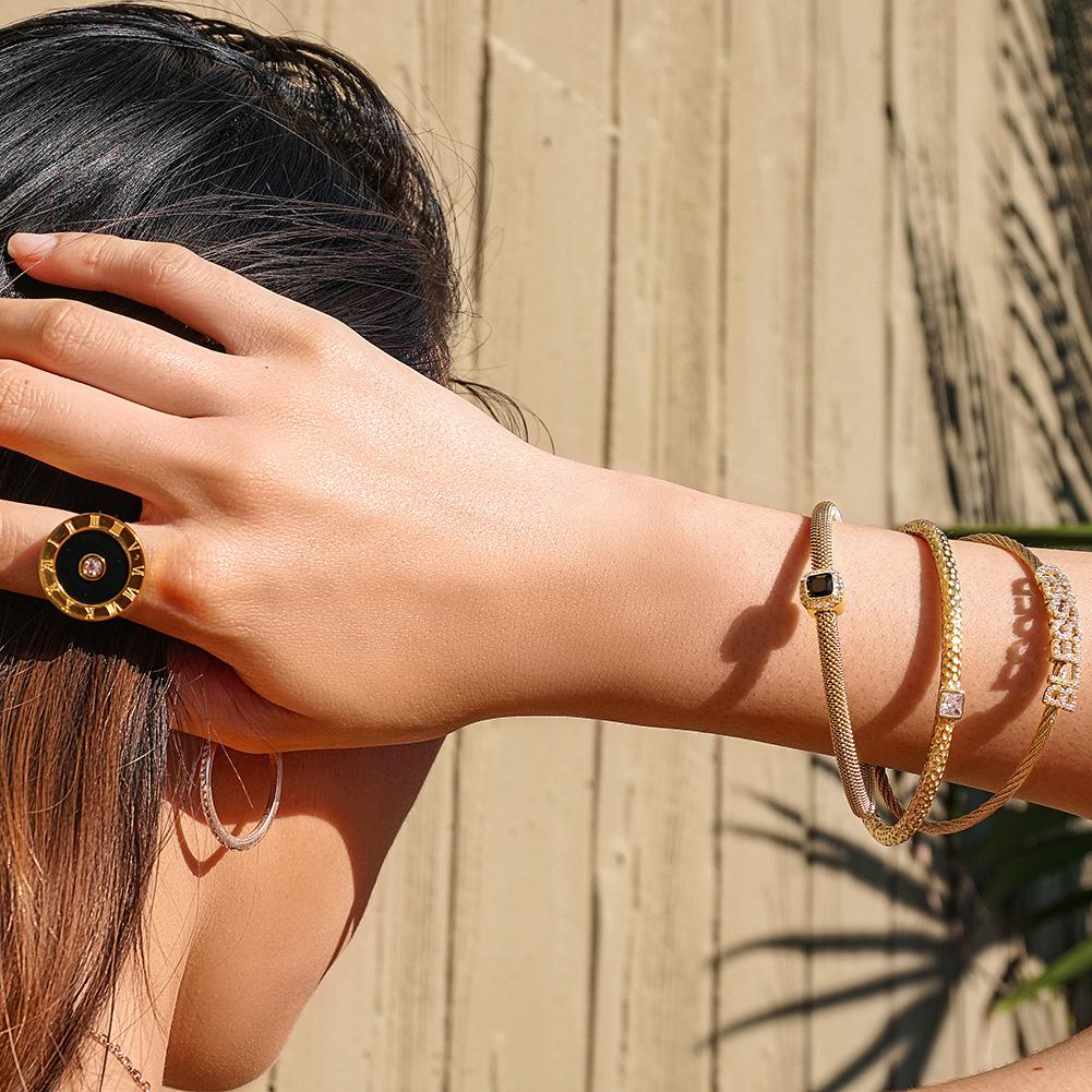 Triple Bangle Set featuring 'blessed' design in gold with cubic zirconia accents, elegantly displayed in a gift box.