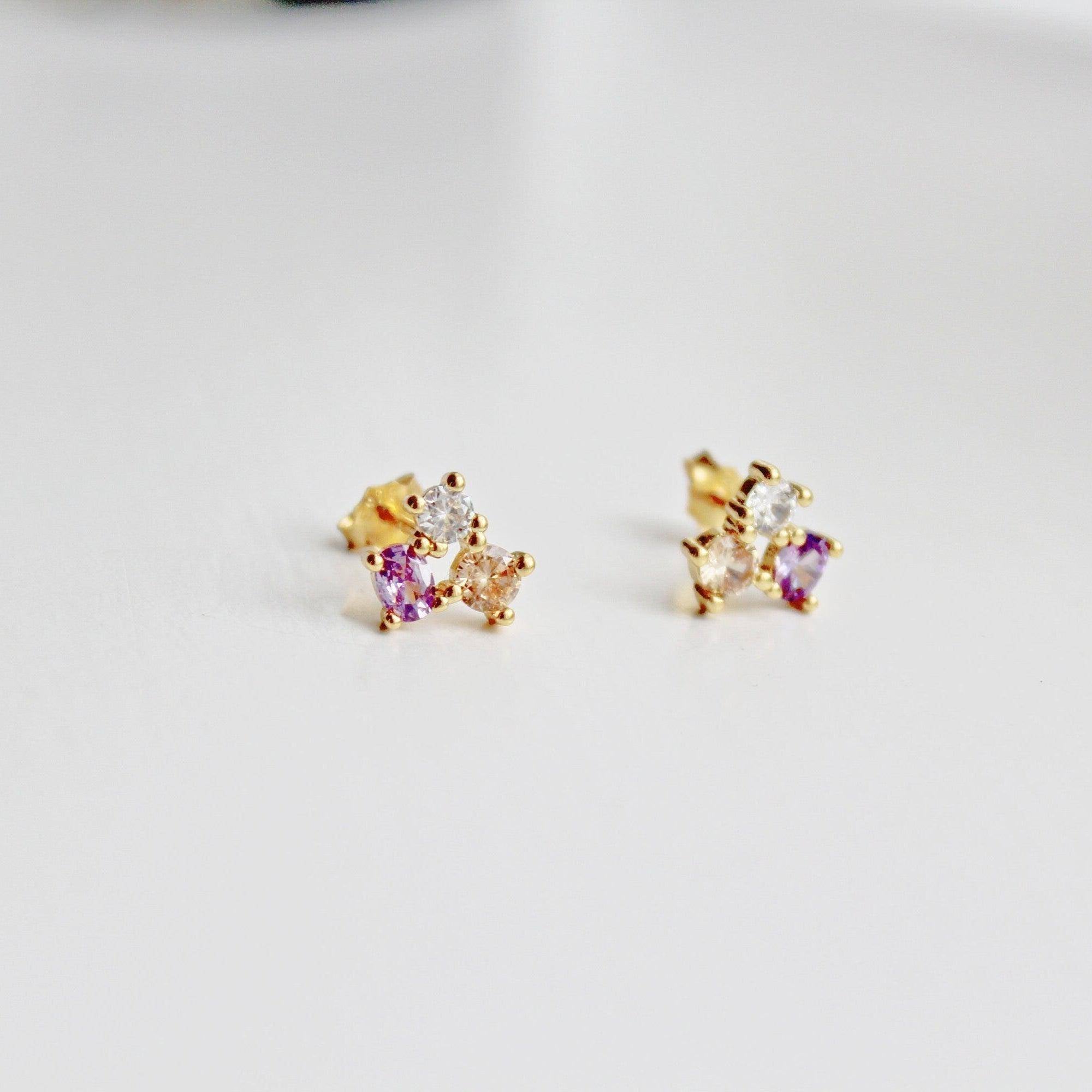 Tiny Triple Oval Earrings in gold-coated sterling silver with zircon crystals, showcasing a unique geometric design.