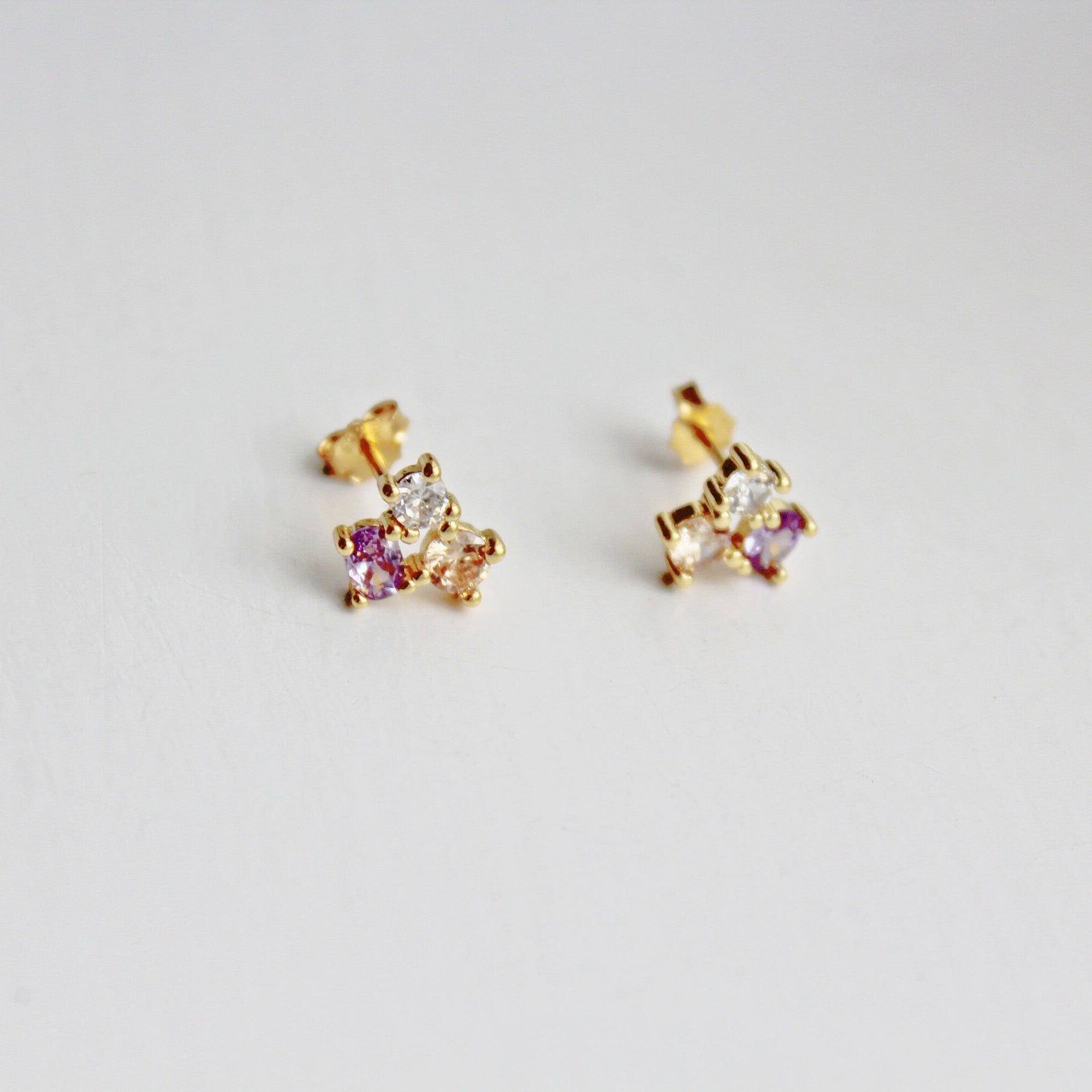 Tiny Triple Oval Earrings in gold-coated sterling silver with zircon crystals, showcasing a unique geometric design.