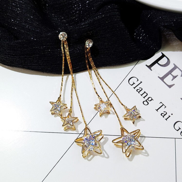 Triple Rhinestone Star Tassels Earrings featuring sparkling rhinestones and a chic star design, perfect for any occasion.