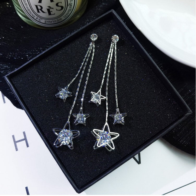 Triple Rhinestone Star Tassels Earrings featuring sparkling rhinestones and a chic star design, perfect for any occasion.