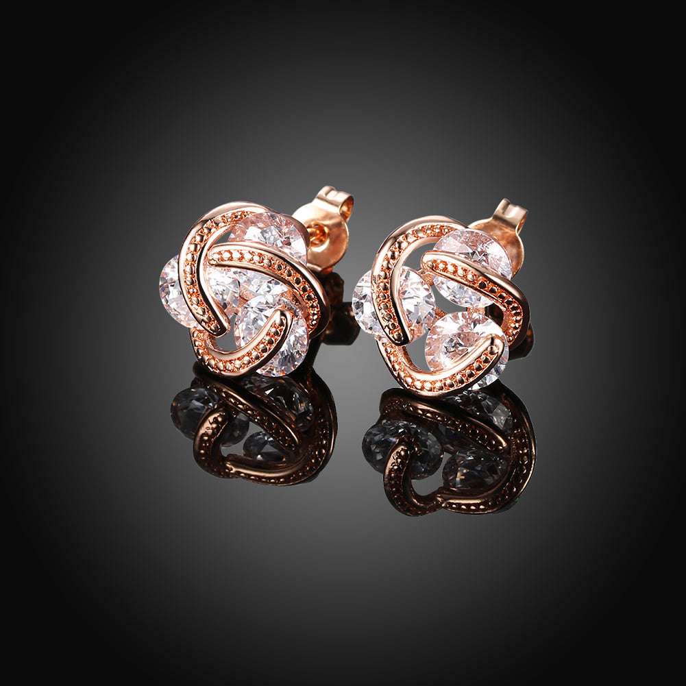Triple Stone Knot Stud Earring in 18K Rose Gold Plated with Crystals, showcasing elegant design and sparkling details.