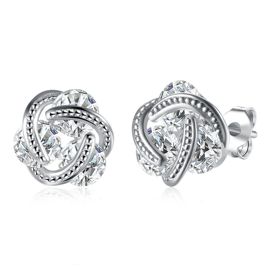 Triple Stone Knot Stud Earrings in 18K White Gold Plated with Crystals, featuring a unique design and sparkling stones.