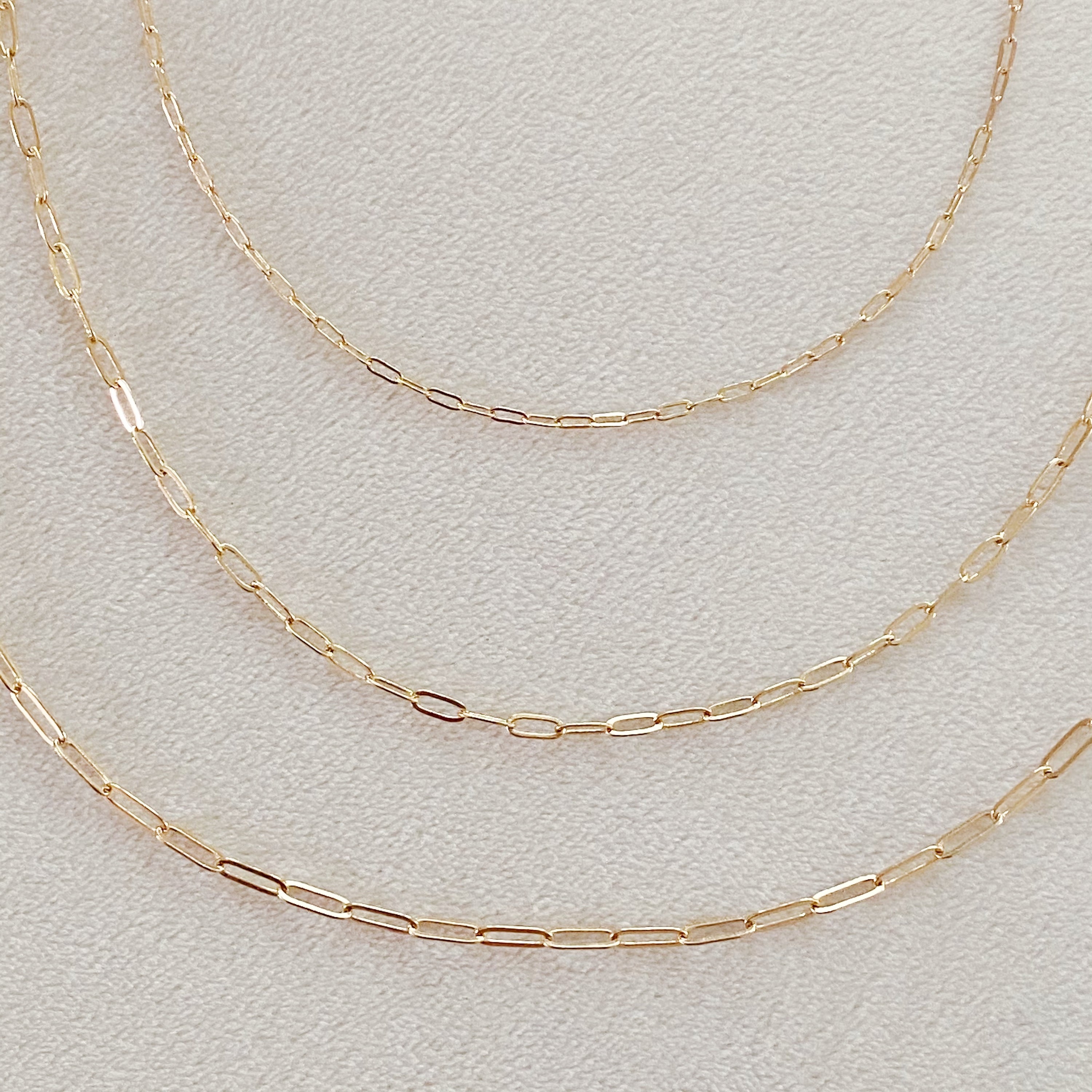 Triple The Fun Chain Link Necklace set featuring three distinct dainty chains in alloy metal with adjustable lengths.