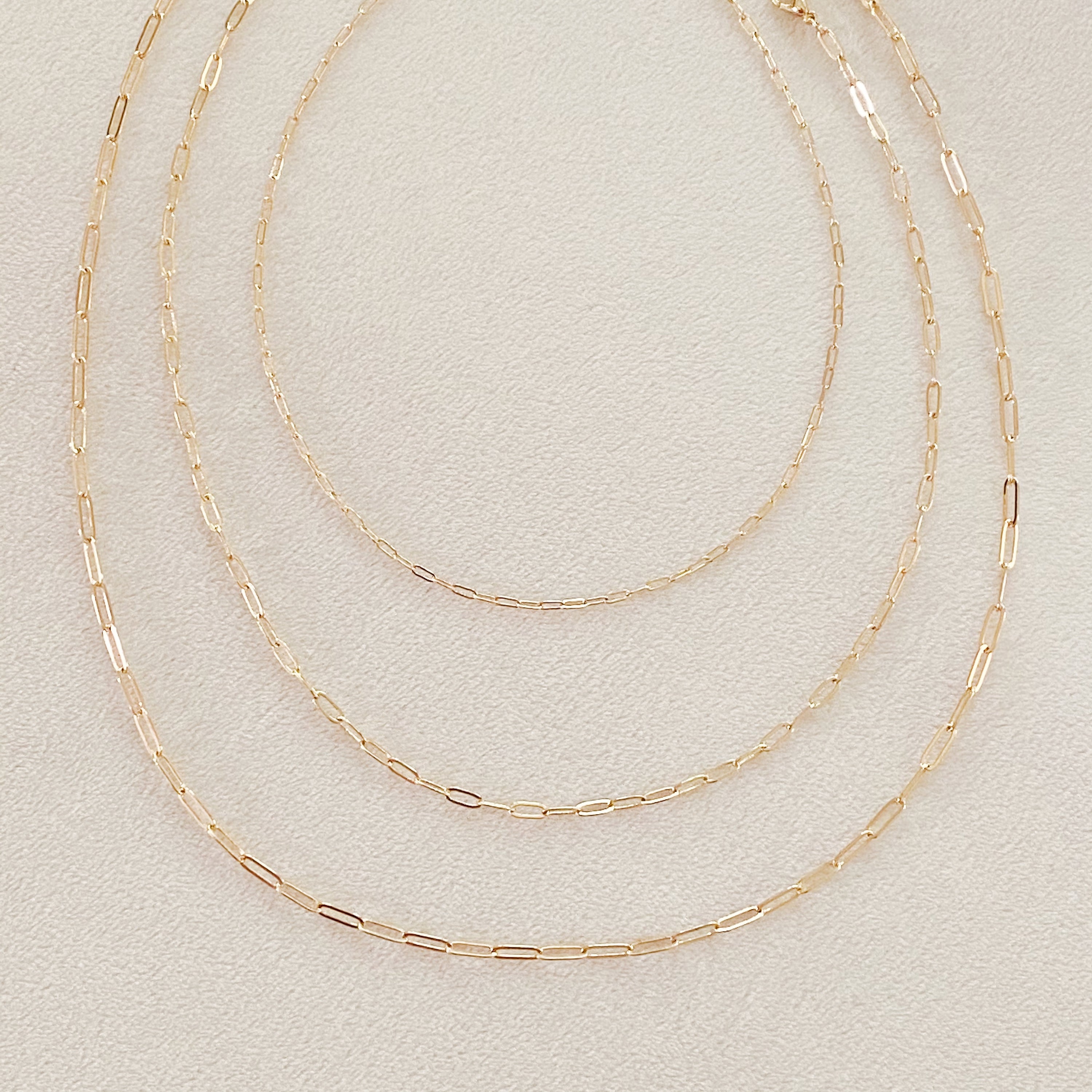 Triple The Fun Chain Link Necklace set featuring three distinct dainty chains in alloy metal with adjustable lengths.