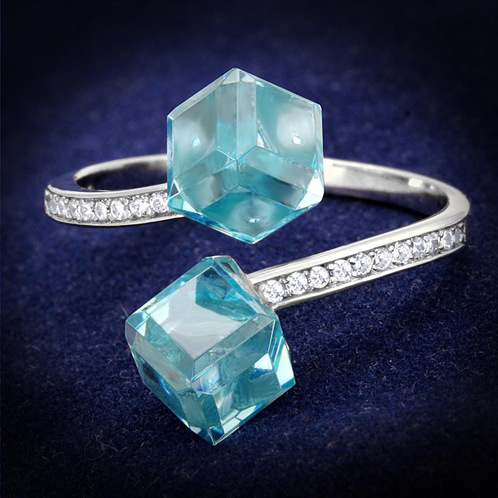 TS317 Rhodium 925 Sterling Silver Ring featuring a stunning AAA Grade CZ in sea blue color, showcasing its elegant design and craftsmanship.
