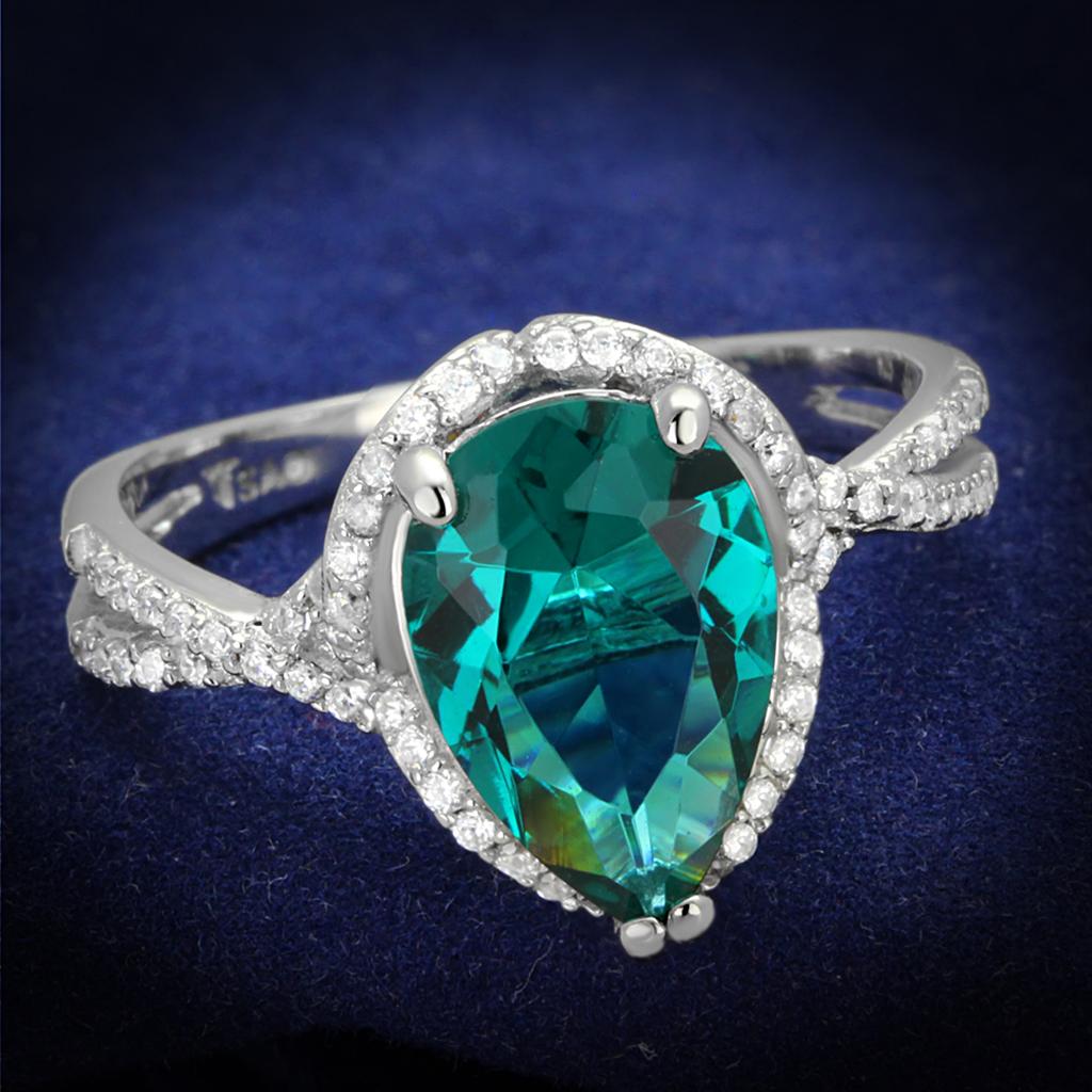 TS394 Rhodium 925 Sterling Silver Ring featuring a synthetic blue zircon stone, showcasing its elegant design and shiny finish.