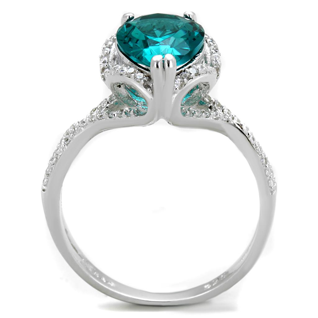 TS394 Rhodium 925 Sterling Silver Ring featuring a synthetic blue zircon stone, showcasing its elegant design and shiny finish.