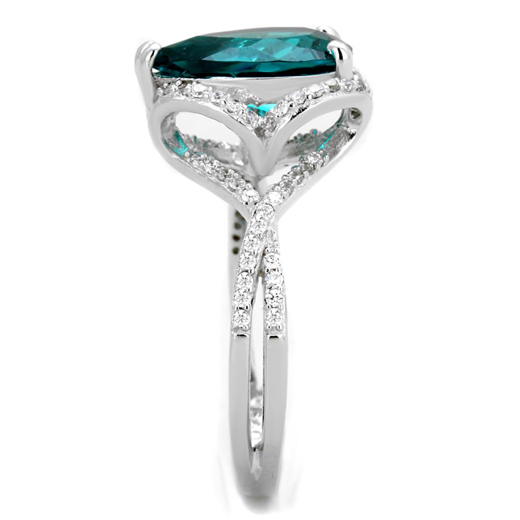 TS394 Rhodium 925 Sterling Silver Ring featuring a synthetic blue zircon stone, showcasing its elegant design and shiny finish.