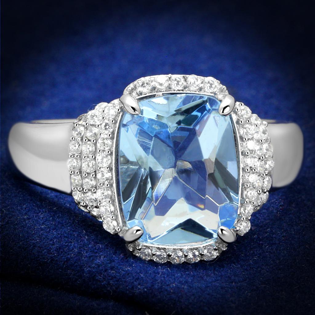 TS562 Rhodium 925 Sterling Silver Ring featuring a light sapphire synthetic glass center stone, elegantly designed for modern style.