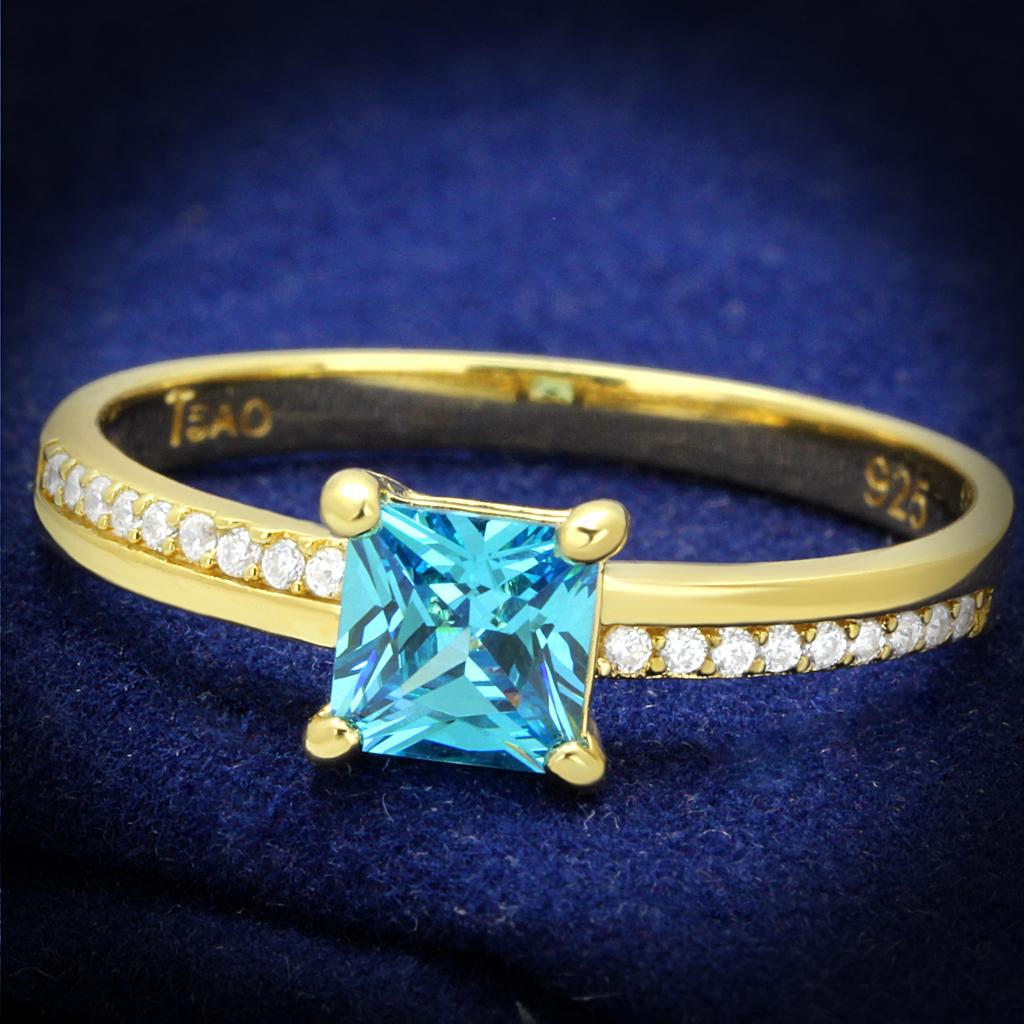 TS559 Gold 925 Sterling Silver Ring featuring a vibrant sea blue AAA Grade CZ stone, elegantly designed for luxury and comfort.