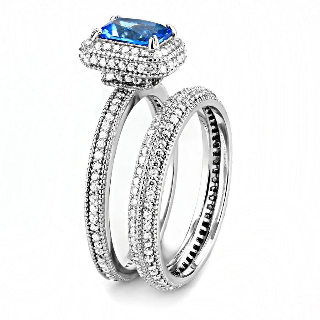 TS615 Rhodium 925 Sterling Silver Ring featuring a sea blue synthetic glass stone, showcasing its elegant design and shiny finish.