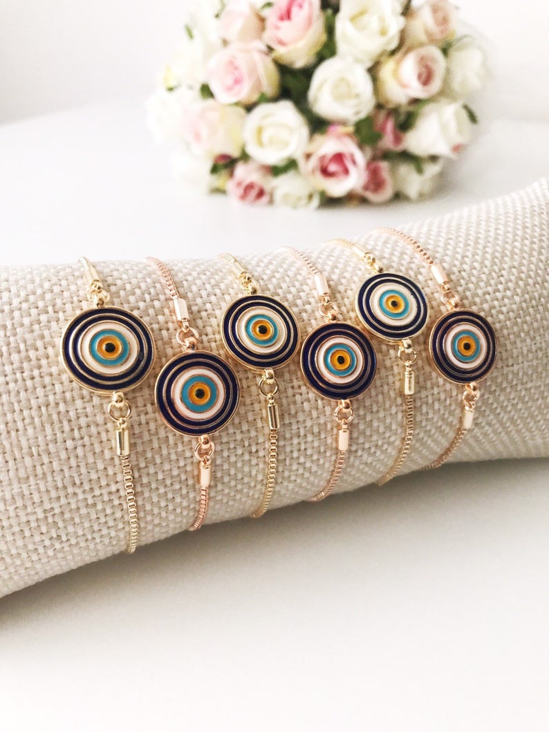 Turkish Evil Eye Bracelet in rose gold with adjustable design and blue enamel charm, showcasing its elegant craftsmanship and protective symbolism.