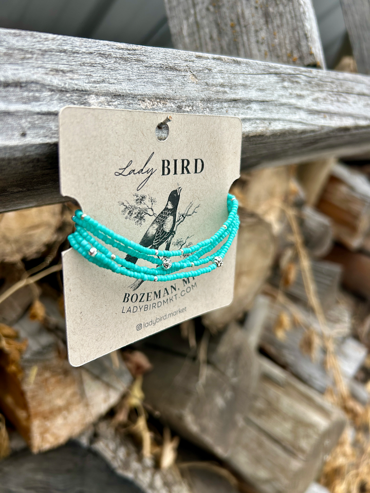 Turquoise and chunky gold or silver boho beaded wrap bracelet, showcasing vibrant Czech glass seed beads and metallic accents.